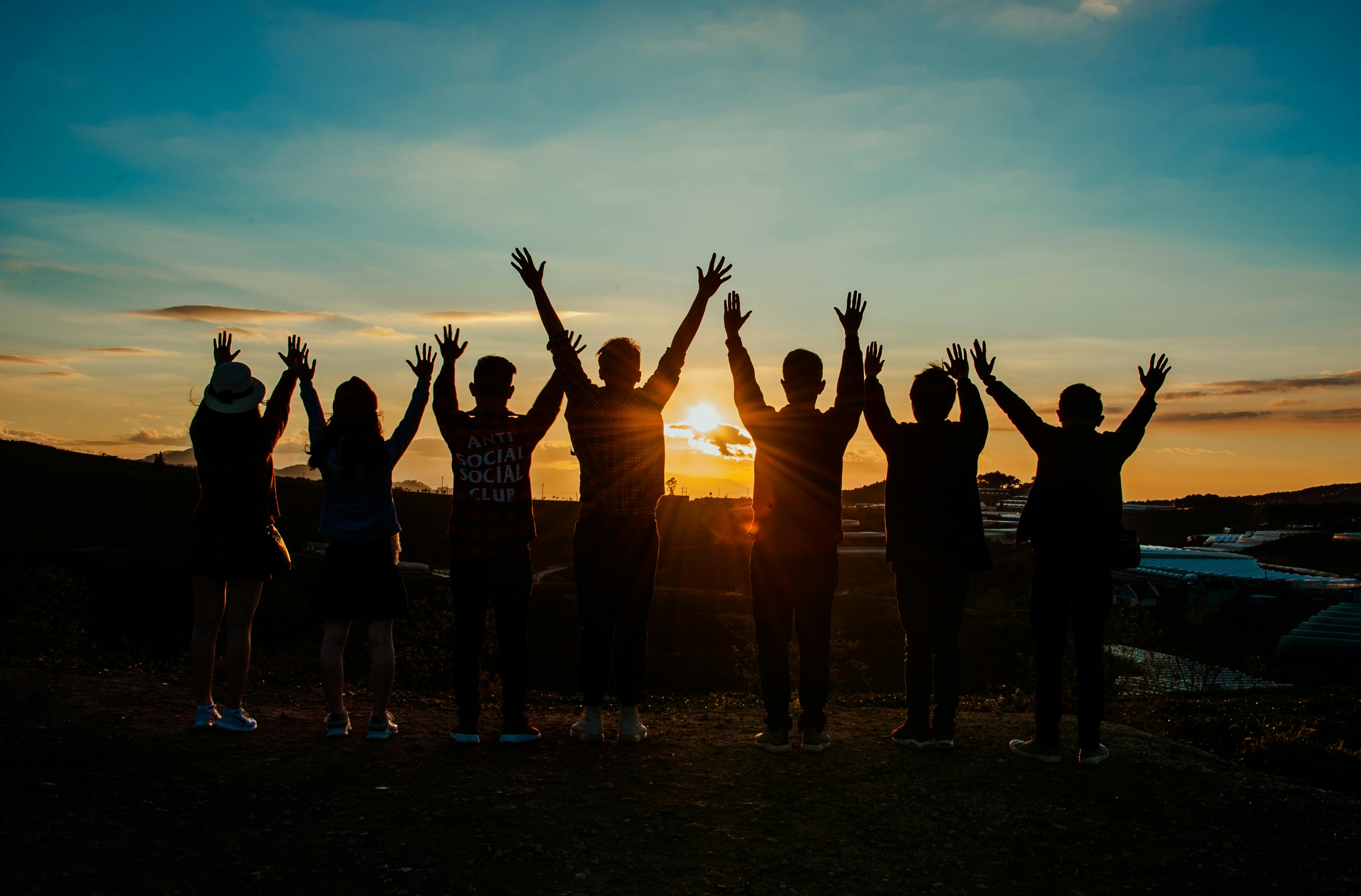 A group of people watching the sun rise